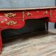 Louis XV style curved center desk in red lacquer and gilded bronze