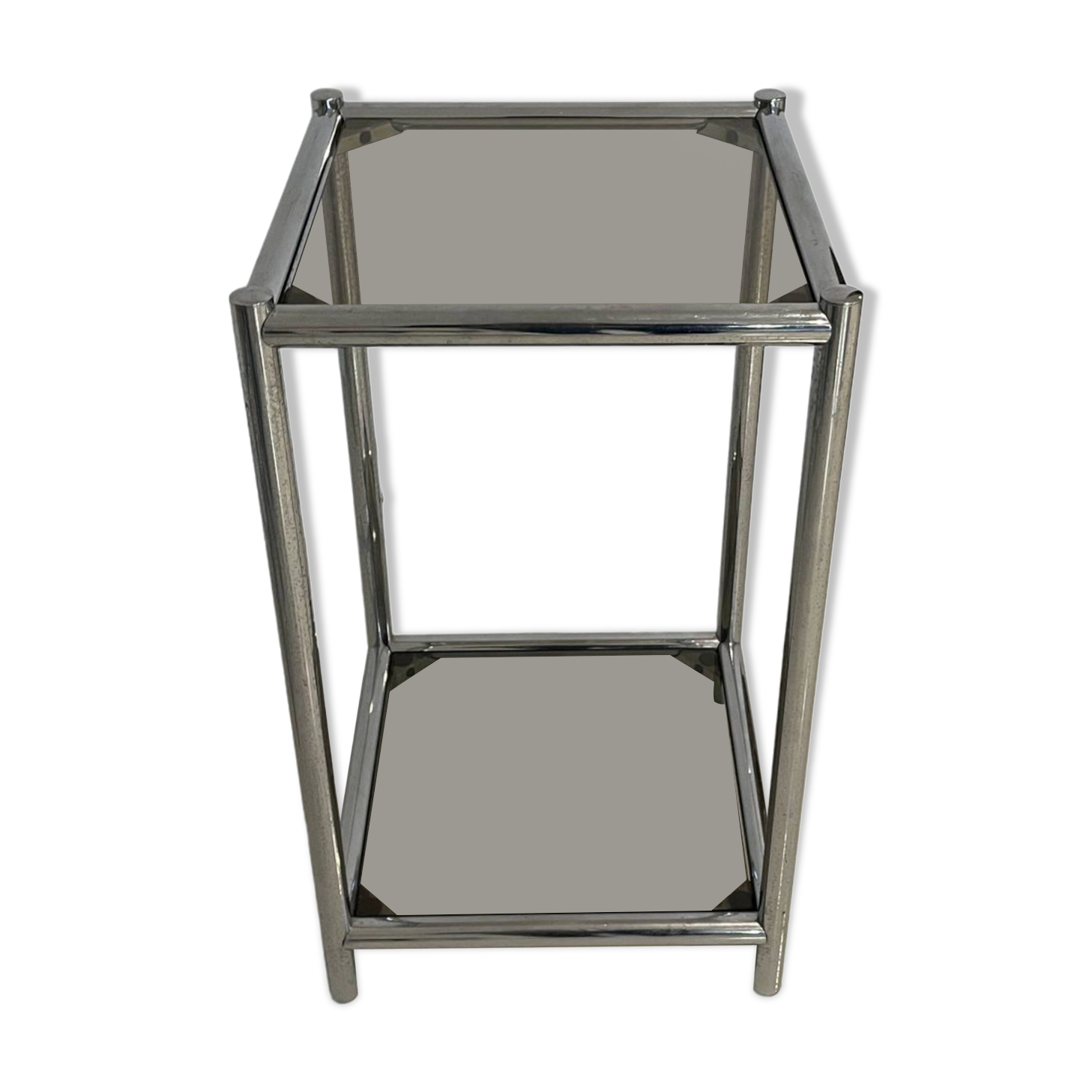 Bolster or end table in chrome steel with smoked window.