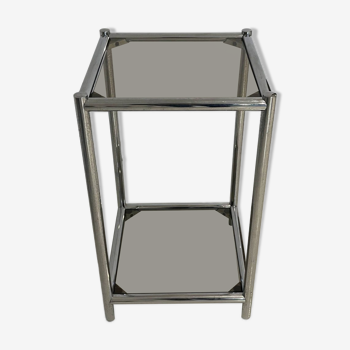 Bolster or end table in chrome steel with smoked window.