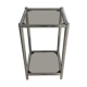 Bolster or end table in chrome steel with smoked window.