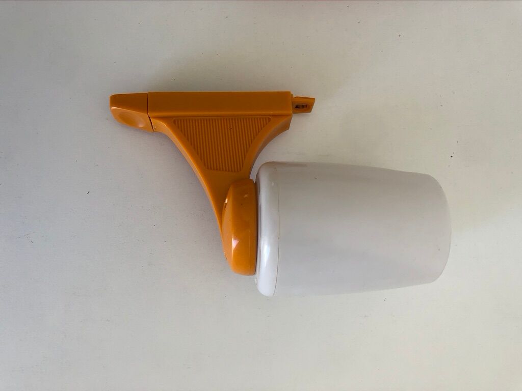 Tiltable orange plastic mirror with matching wall light