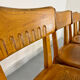Set of 4 vintage solid oak chairs, 1960s design with sculpted backrest.