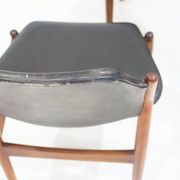 Set of four Arne Vodder chairs in hardwood and black leather.