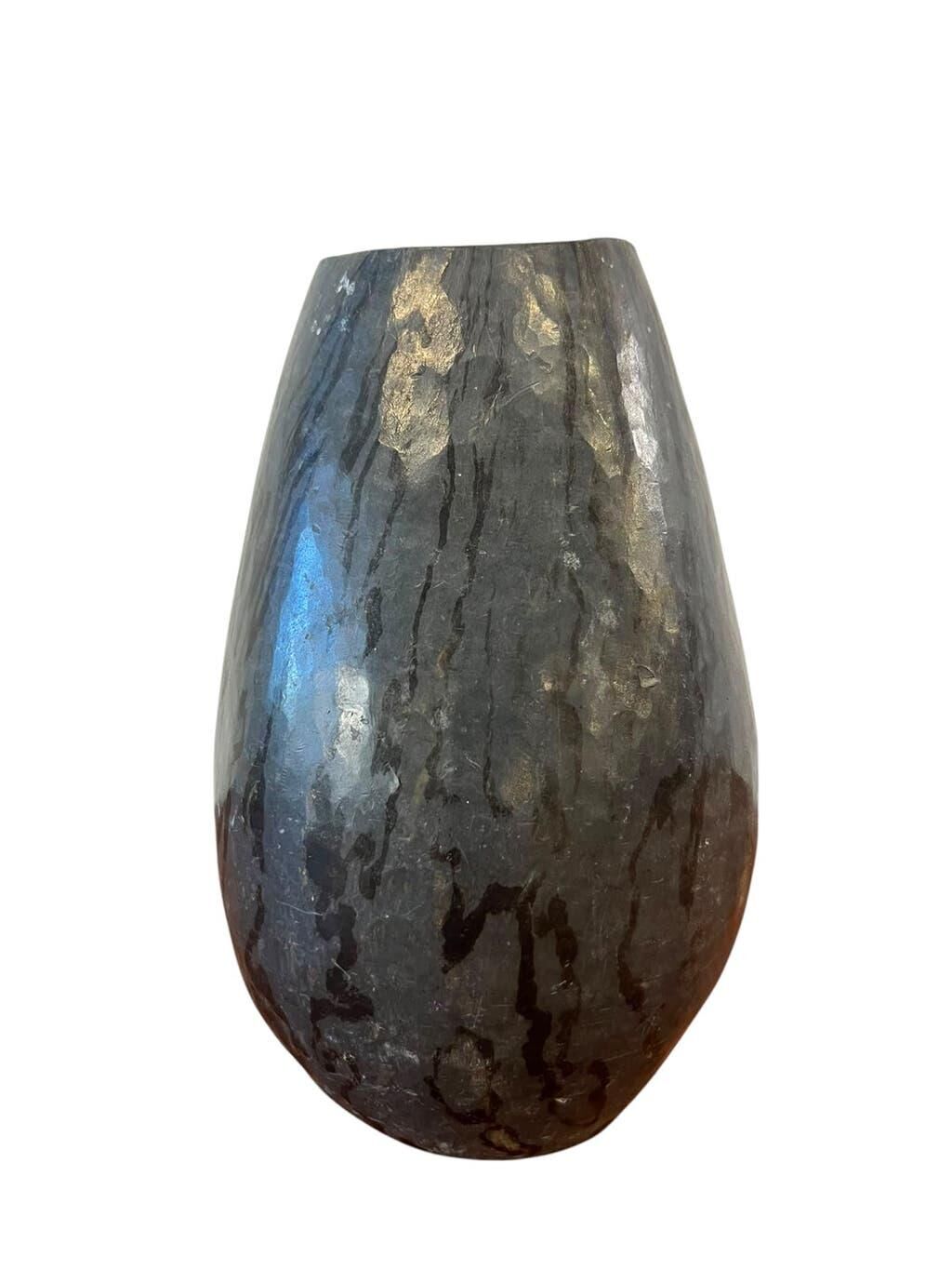 Vintage stone vase with worked fossil