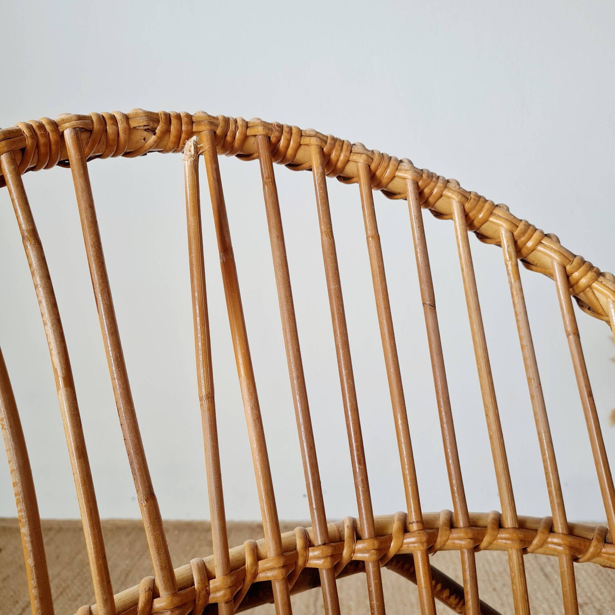 Vintage adult rattan armchair from the 1960s.