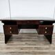 Art Deco executive desk in exotic wood, glass, and brass.