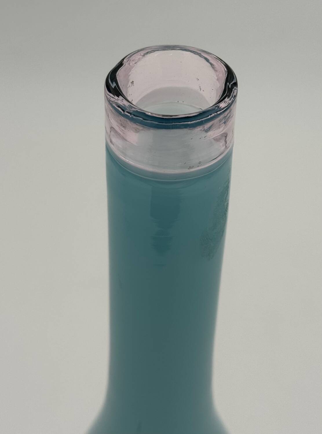 Blue lined glass bottle vase