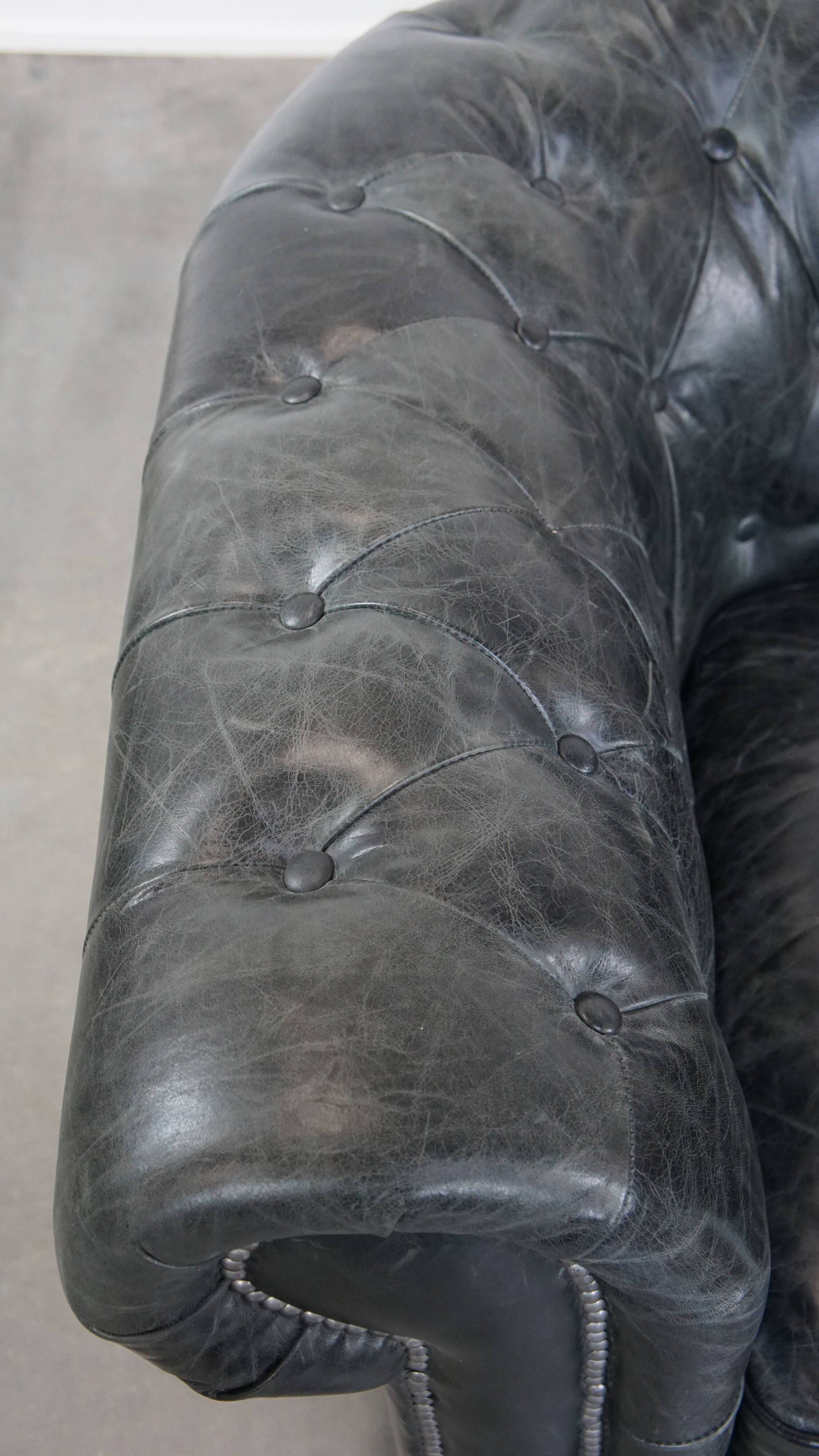 Black cowhide leather chesterfield armchair