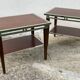 Pair of modernist chrome, leather and wood side tables.