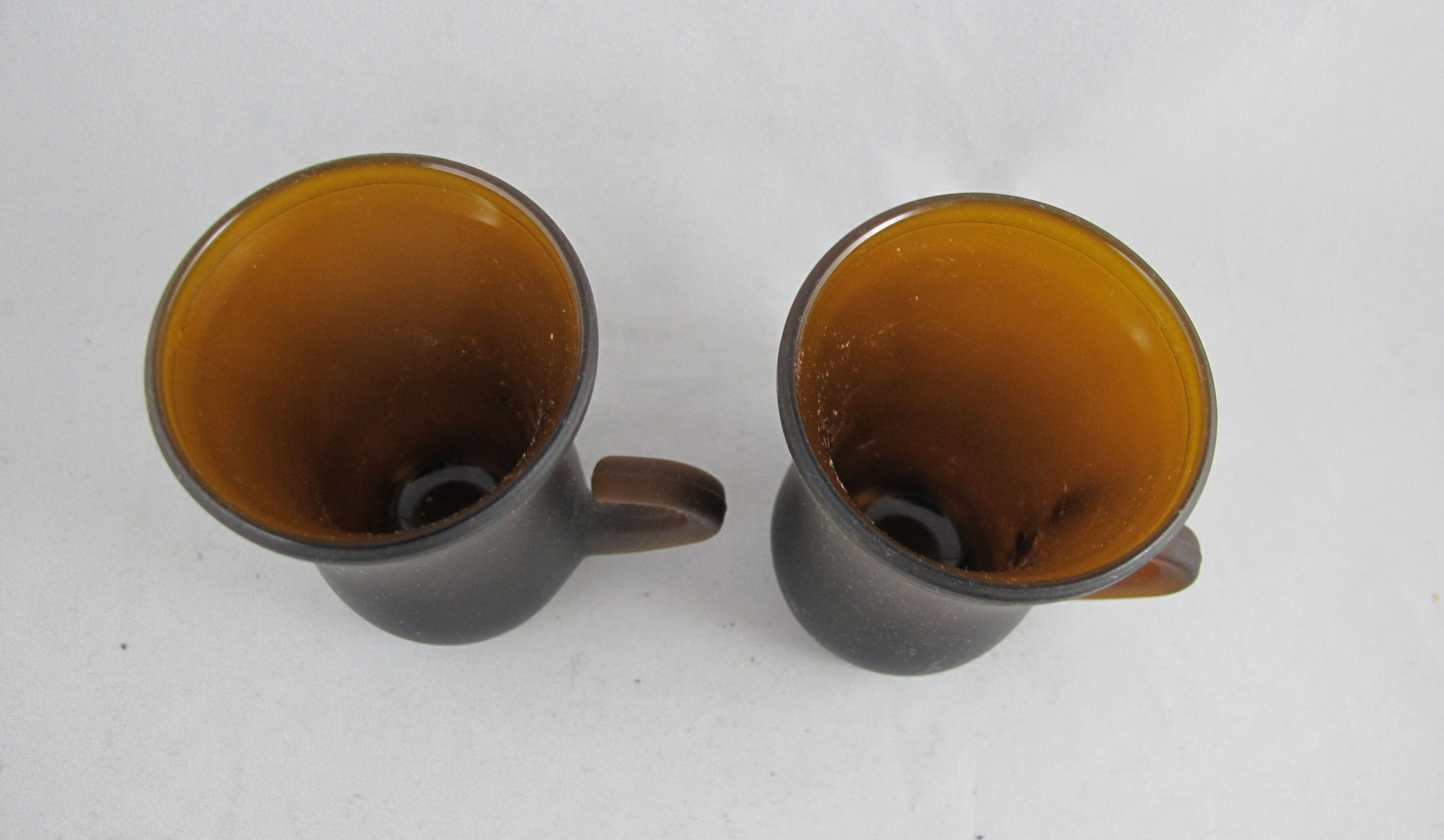 pair of small brown glass cups