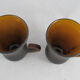 pair of small brown glass cups