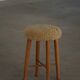Danish sculptural stool from the mid-century modern period with a lambswool seat, 1960s.