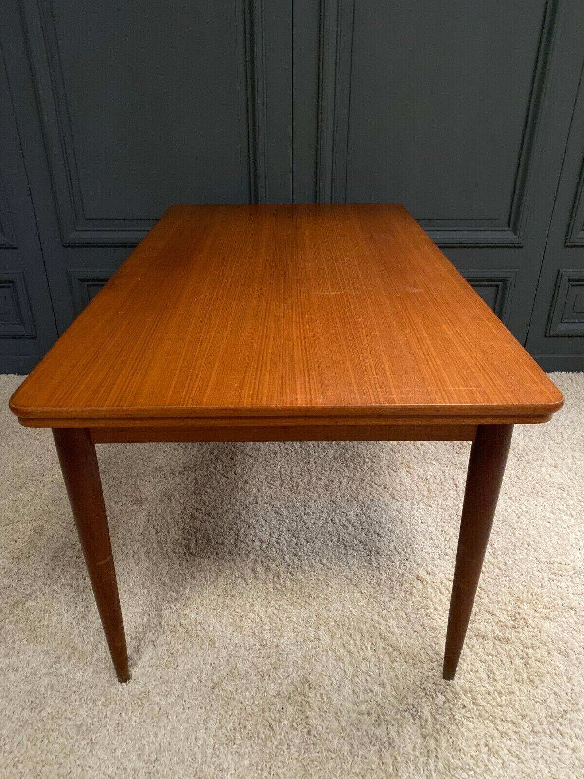 Scandinavian rectangular teak dining table with 4 tapered legs