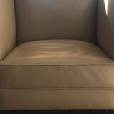 Two armchairs and an Art Deco style pouf