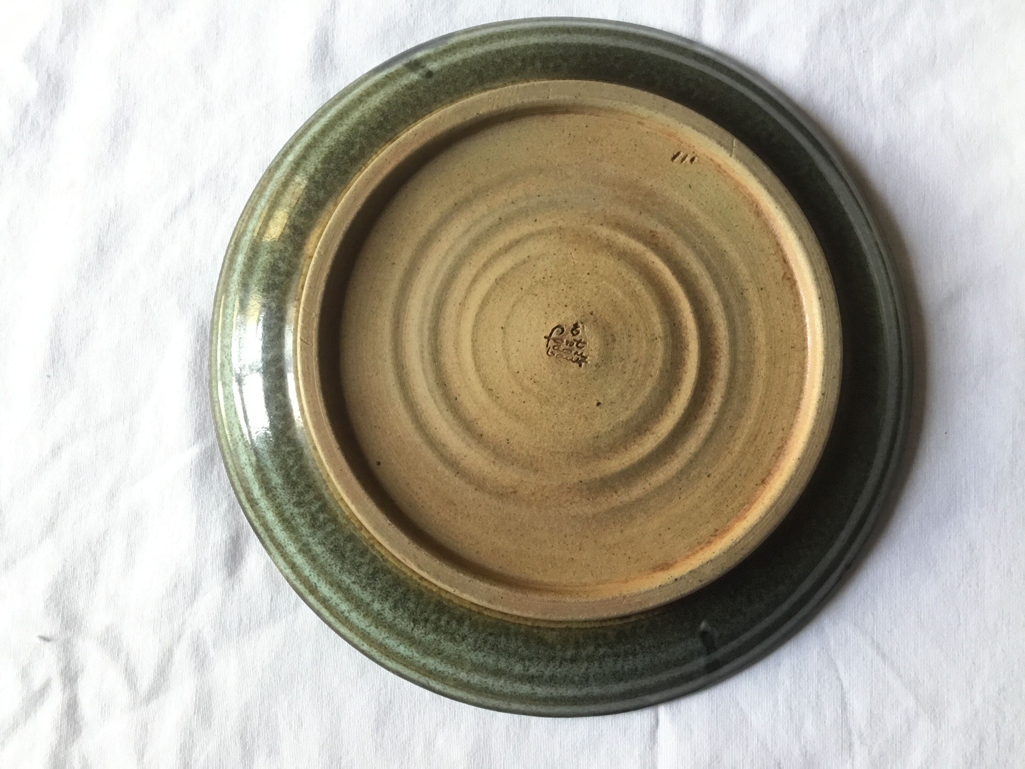 Emailed sandstone plate