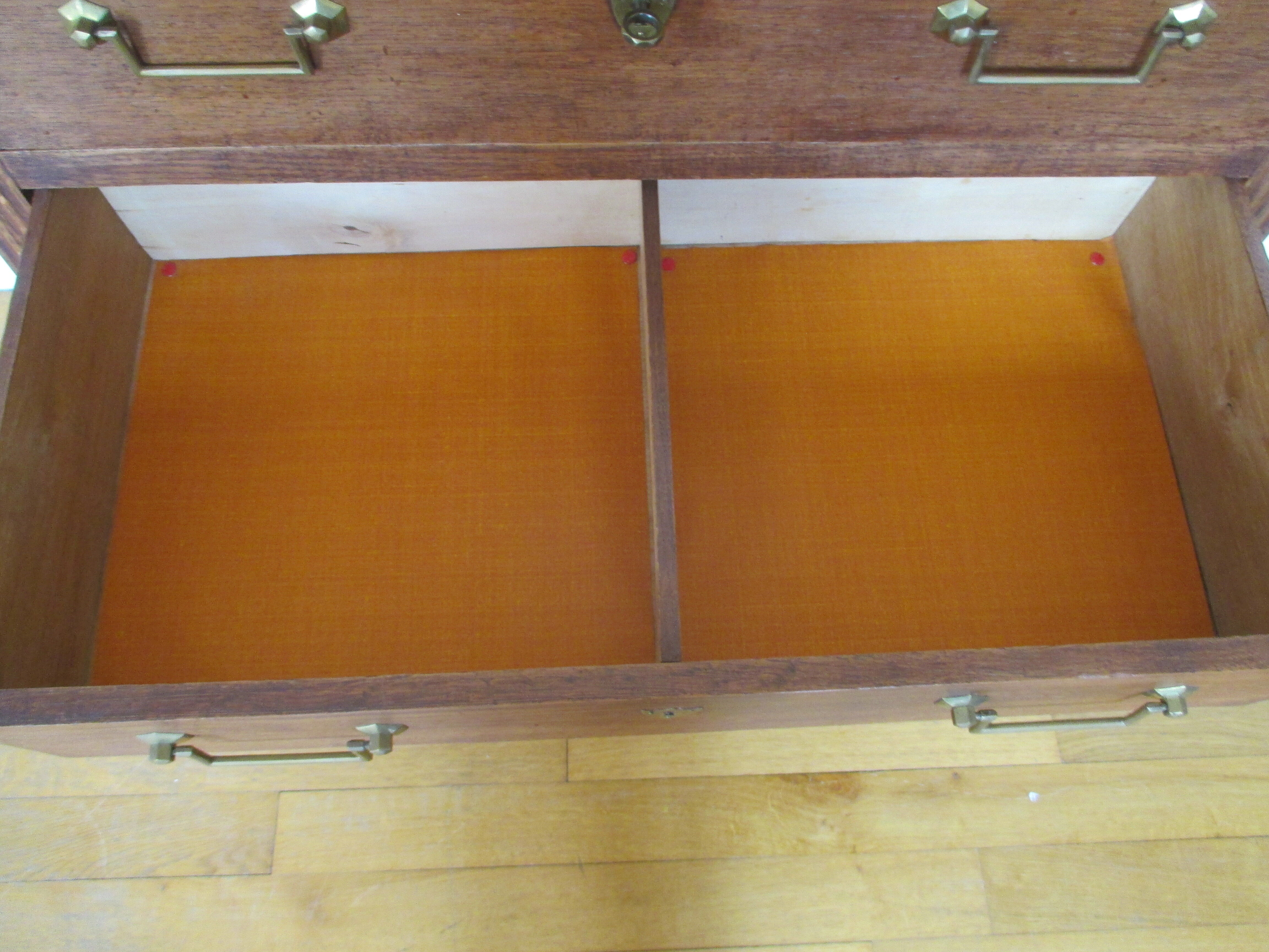 Oak chest of drawers and brass handles