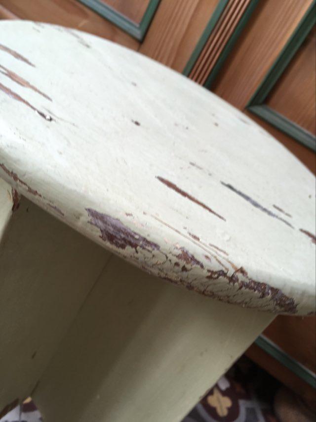 A rough wooden stool patinated by time