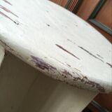 A rough wooden stool patinated by time