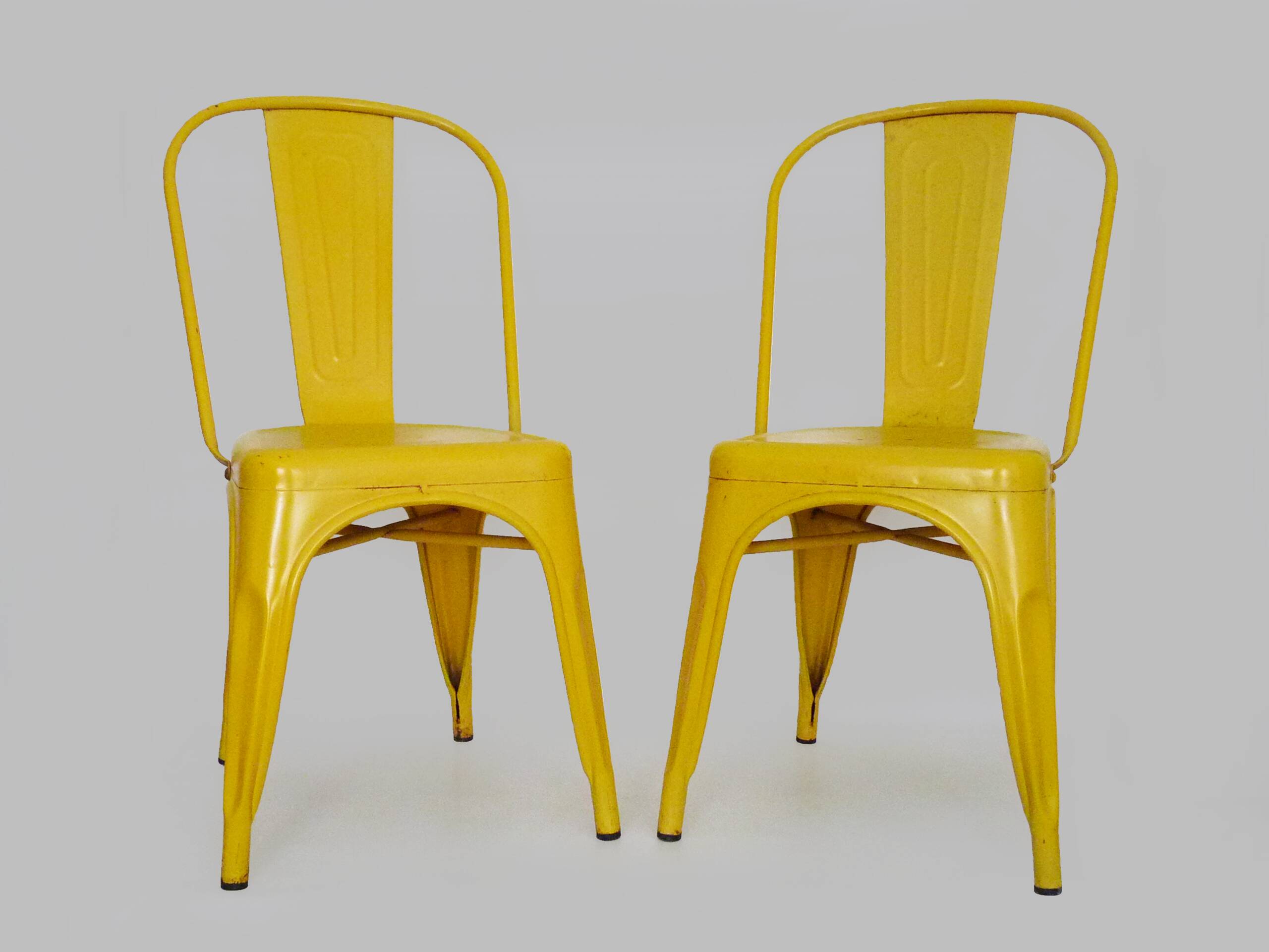 Pair of Tolix Chairs in yellow metal by Xavier Pauchard