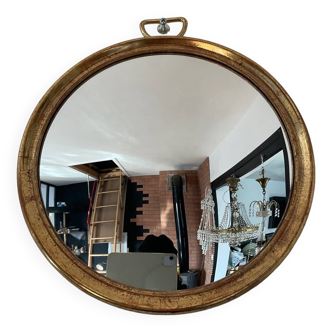 Vintage witch's eye mirror in gilded wood