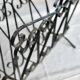 Vintage black metal scroll magazine rack