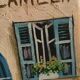 Oil on canvas restaurant storefront, signed À Morin