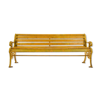 Banc en bois et fonte à patine jaune