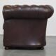 Beautiful and spacious dark brown mottled English cow leather Chesterfield armchair