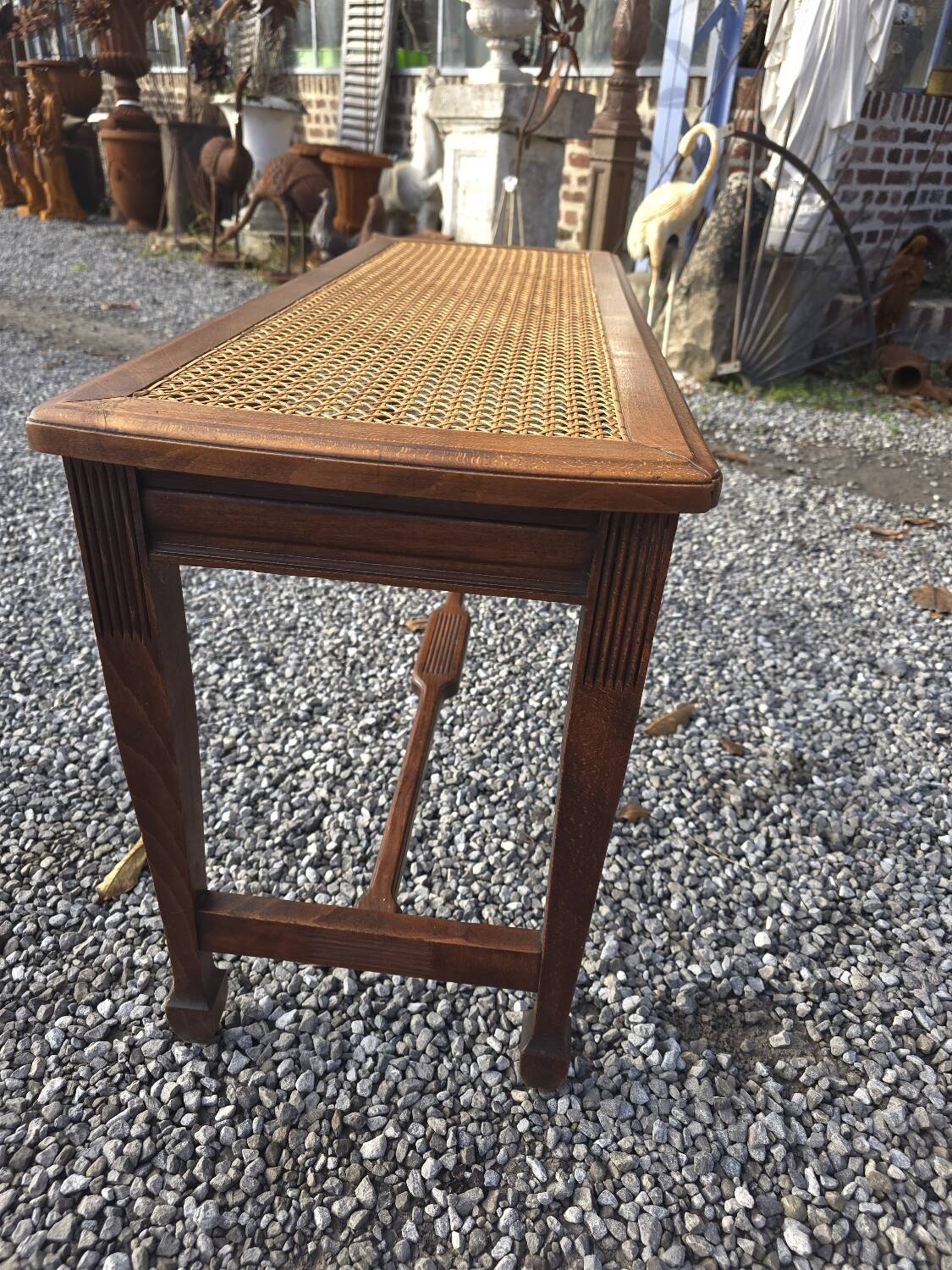 Beechwood piano bench with caning on the seat