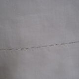 Old sheet in monogram white thread