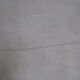 Old sheet in monogram white thread
