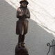 Wooden saddle with statuette, Breton figure, ancient and chiseled, Henri II style