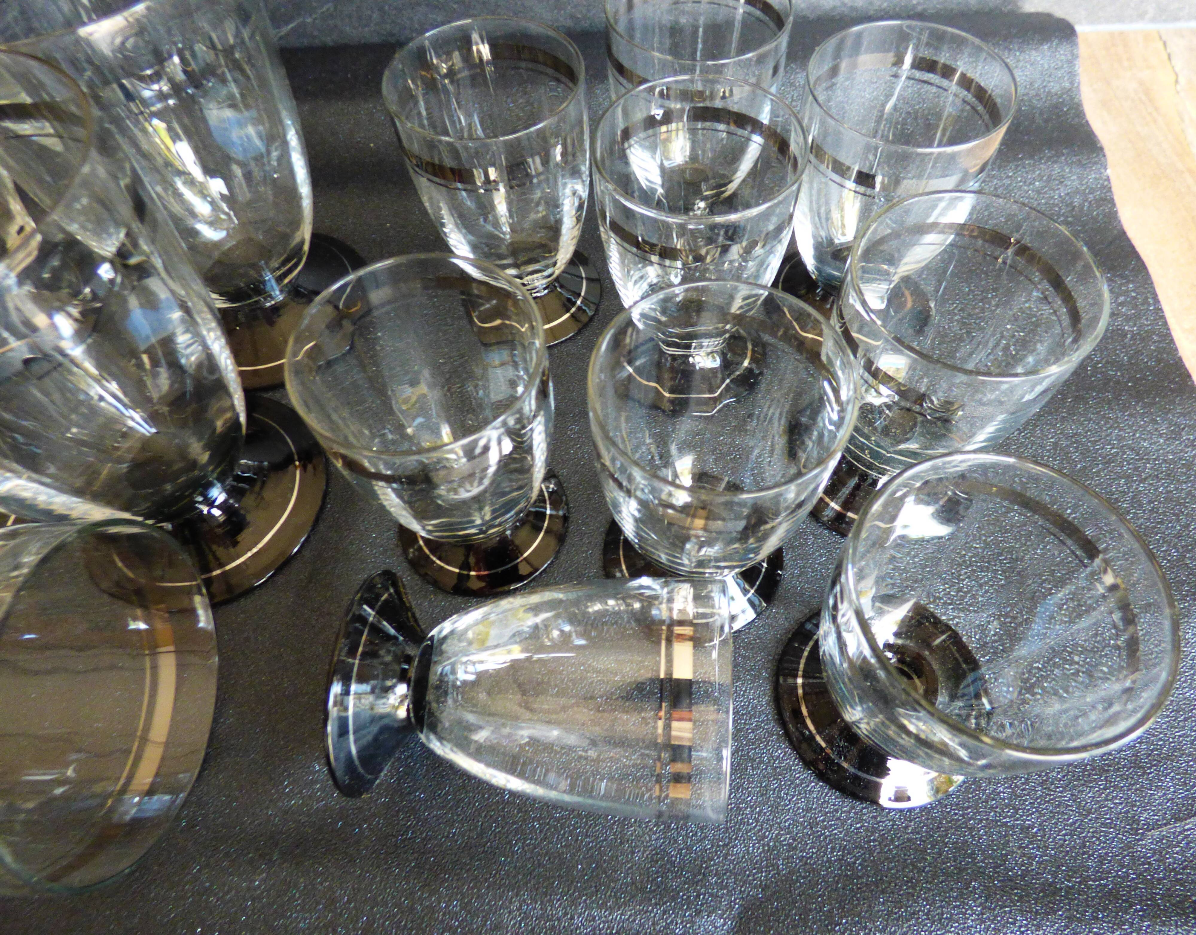 2 series of vintage glasses with black stems from the 1930s.