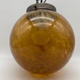 Vintage globe pendant light in amber Clichy glass