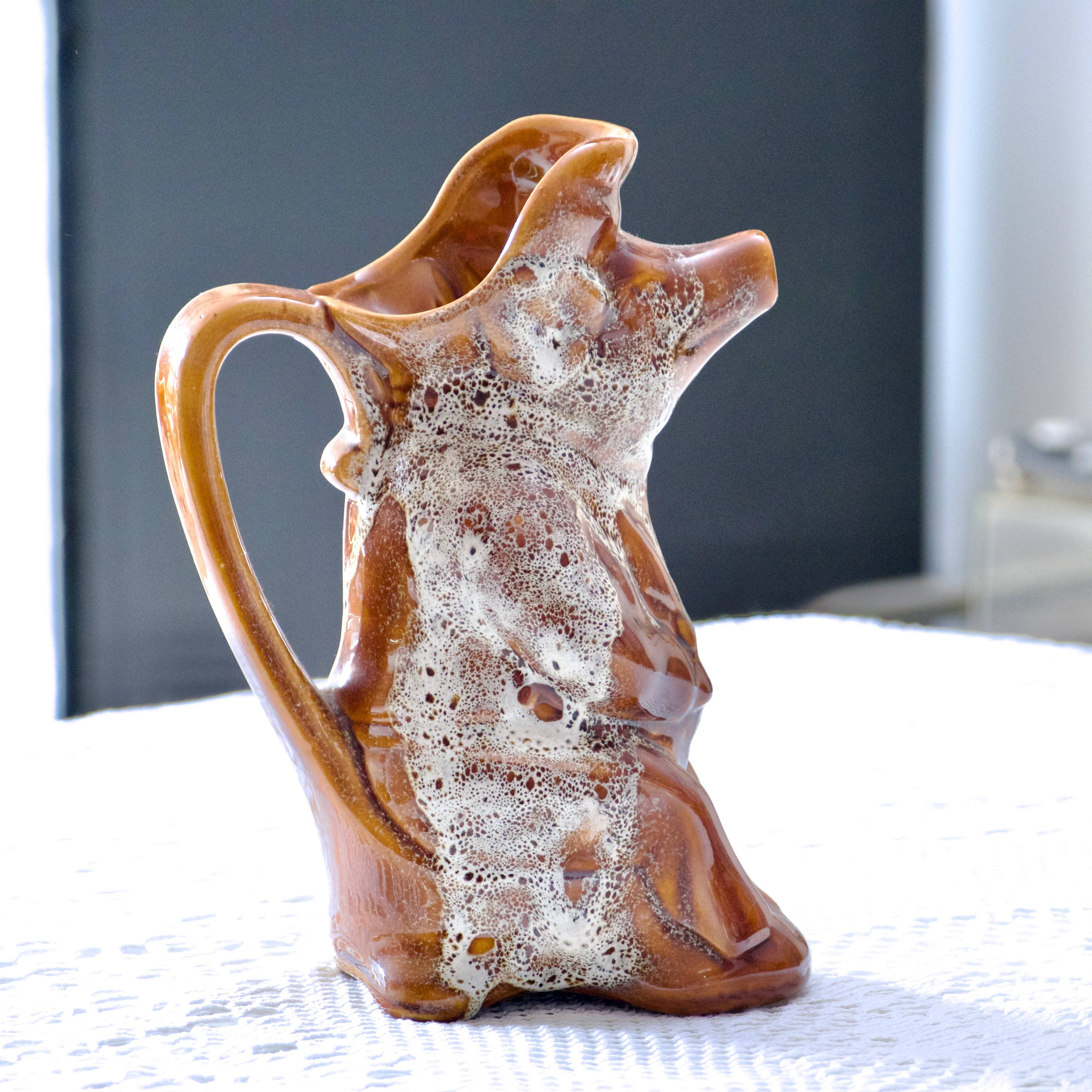 Antique zoomorphic pig carafe in foam-enameled stoneware