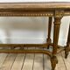 Banquette cannée dorée de style Louis XV