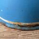 Old painted sheet metal jug or milk jug