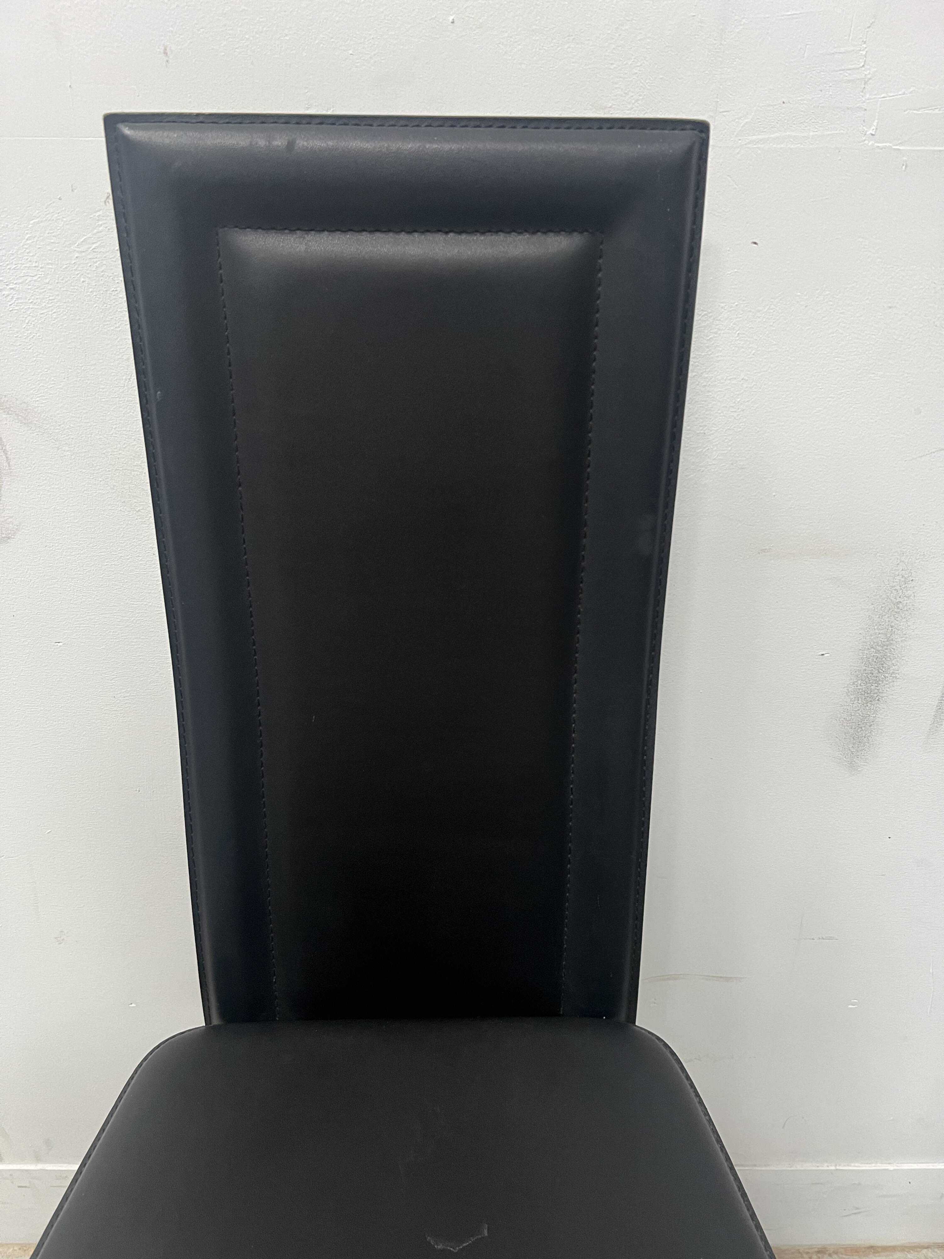 Set of eight designer chairs in black leather from the 20th century