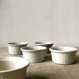 Pleated ramekins for white enamelled crème brûlée.