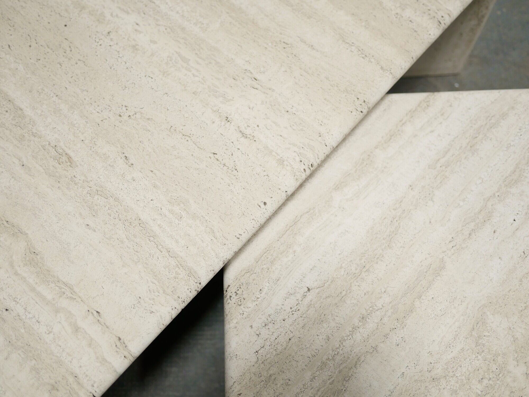 Series of 2 vintage travertine coffee tables published by Roche Bobois