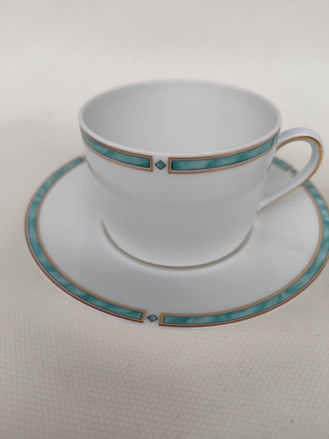 Three-piece Limoges porcelain set. By Bernardaud.
