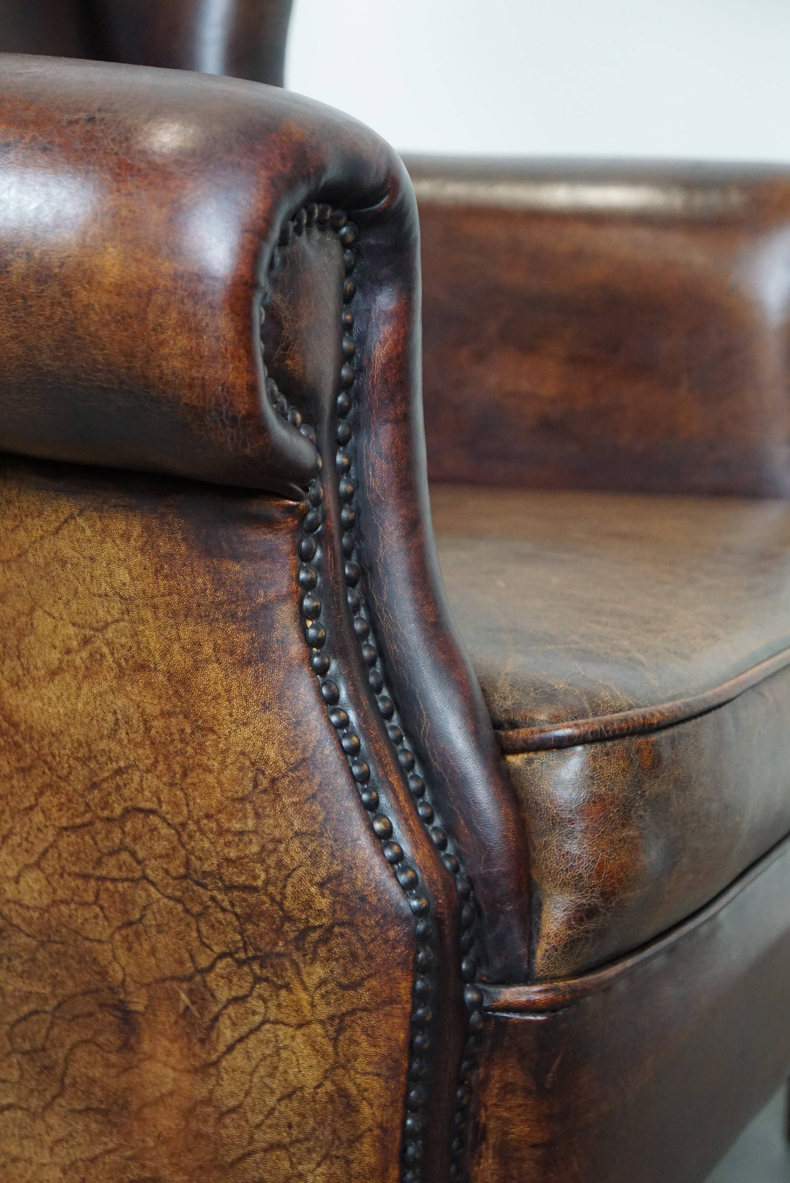 Large Sheepskin Leather Wingback Armchair with a Fixed Seat Cushion and a Stunning Patina