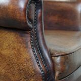 Large Sheepskin Leather Wingback Armchair with a Fixed Seat Cushion and a Stunning Patina