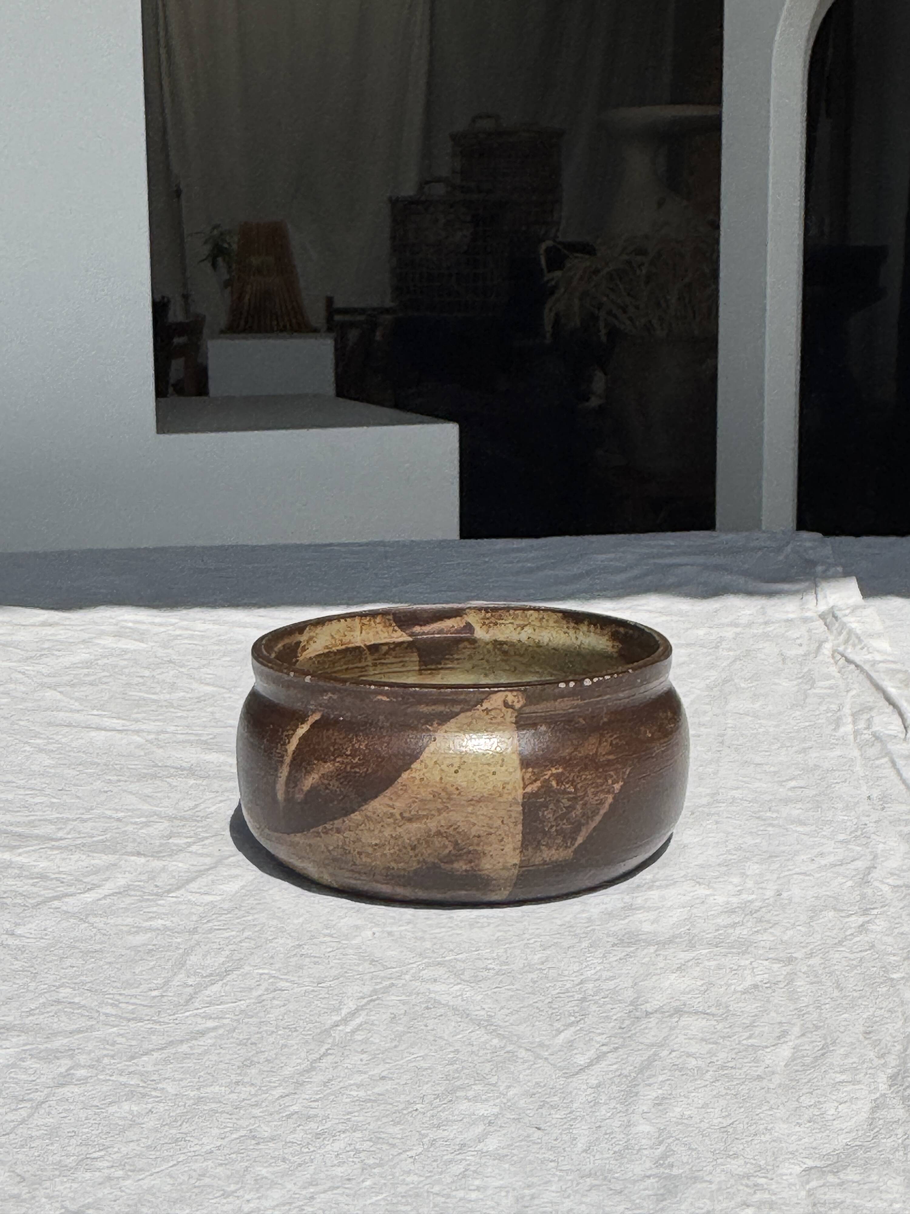 A small stoneware bowl, brown exterior, speckled grey interior D15