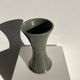 Dark green handcrafted vase with glazed ceramic grass blades