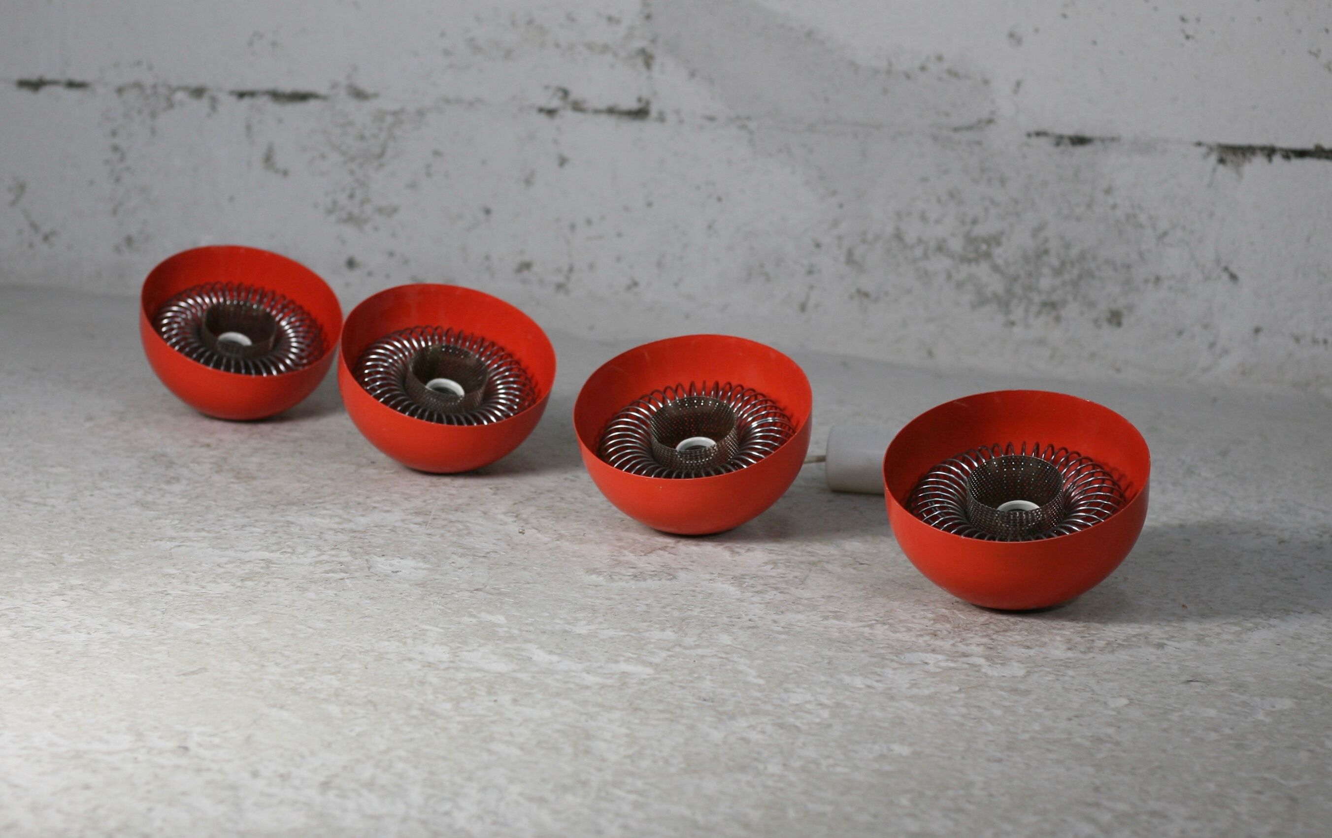 Set of 4 "spring" hanging lamps, orange steel, France, circa 1970