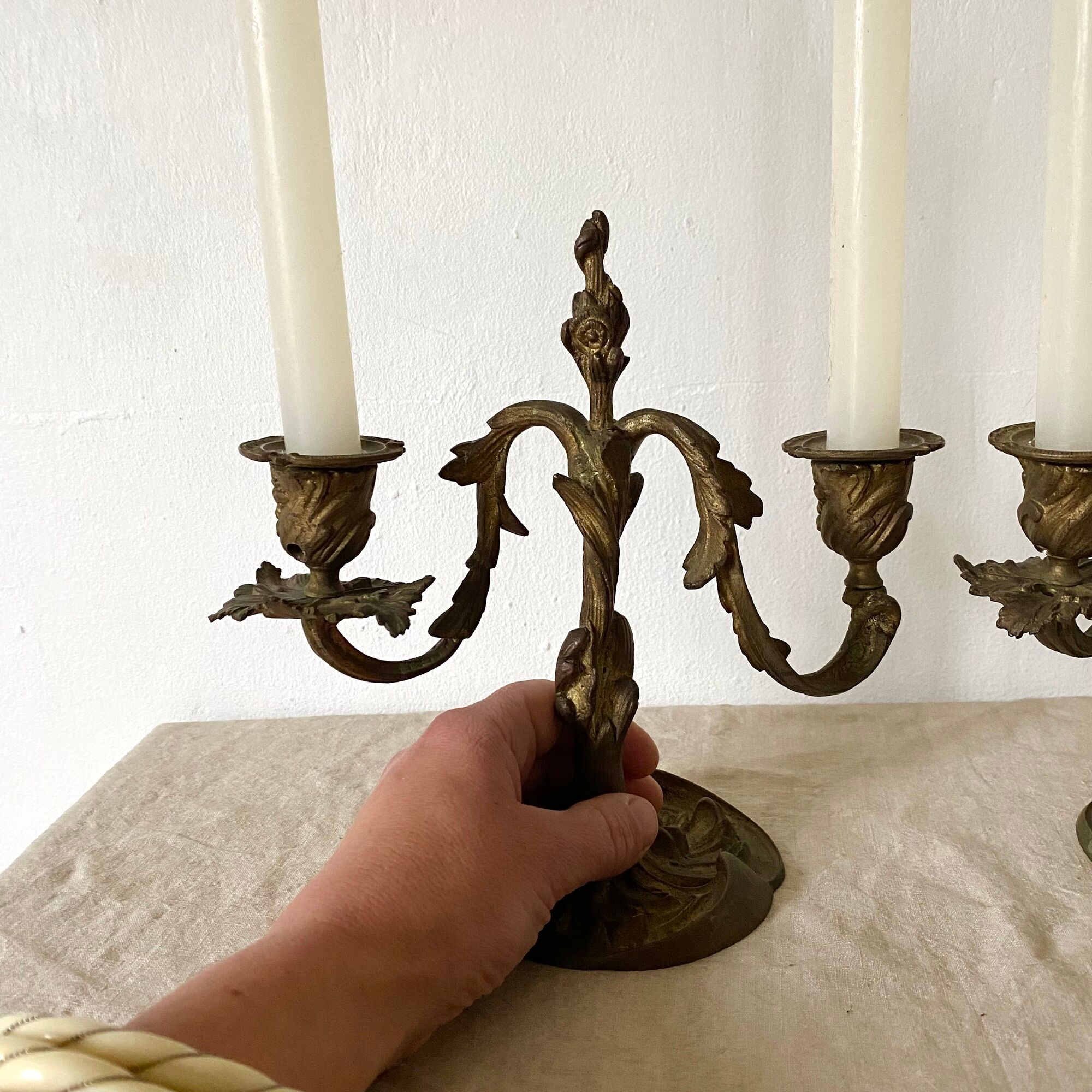 Pair of antique bronze candlesticks at the end of the table XIXth