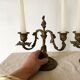 Pair of antique bronze candlesticks at the end of the table XIXth