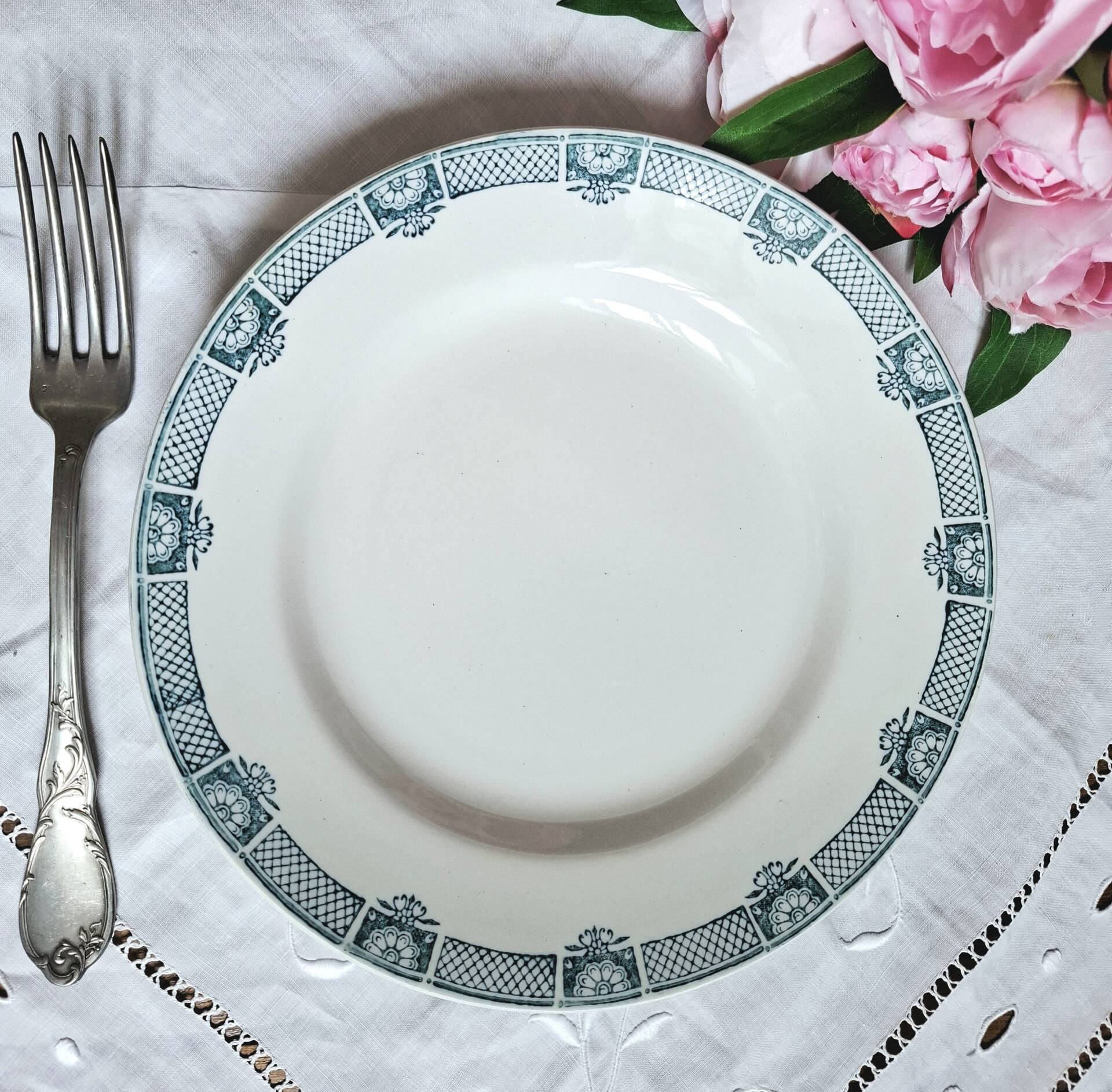 Old mismatched flat plates made of ironstone earthenware.