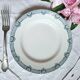 Old mismatched flat plates made of ironstone earthenware.